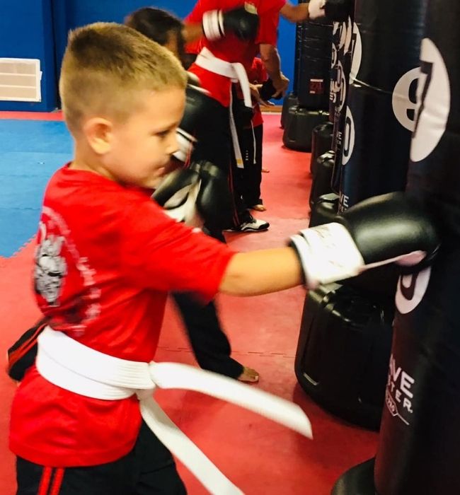 Black Belt Karate Center boy punching bag